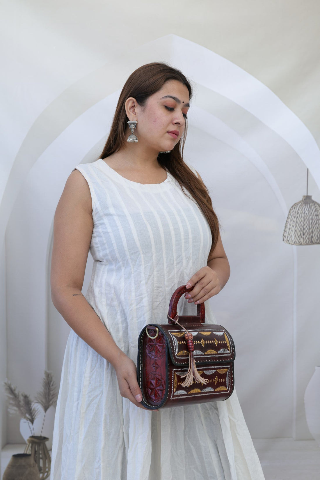 Wood Carv & Leather Jari Round Hut - The Leather Sling